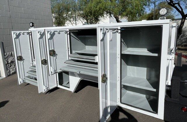 Watt Ventures service body, multiple compartments open showing drawers and shelves