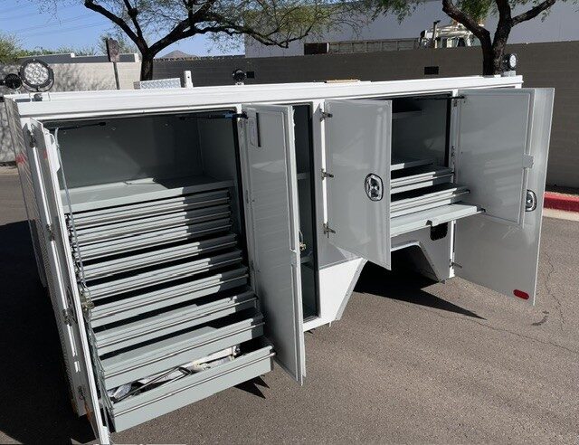 Watt Ventures service body, compartments open showing storage layout